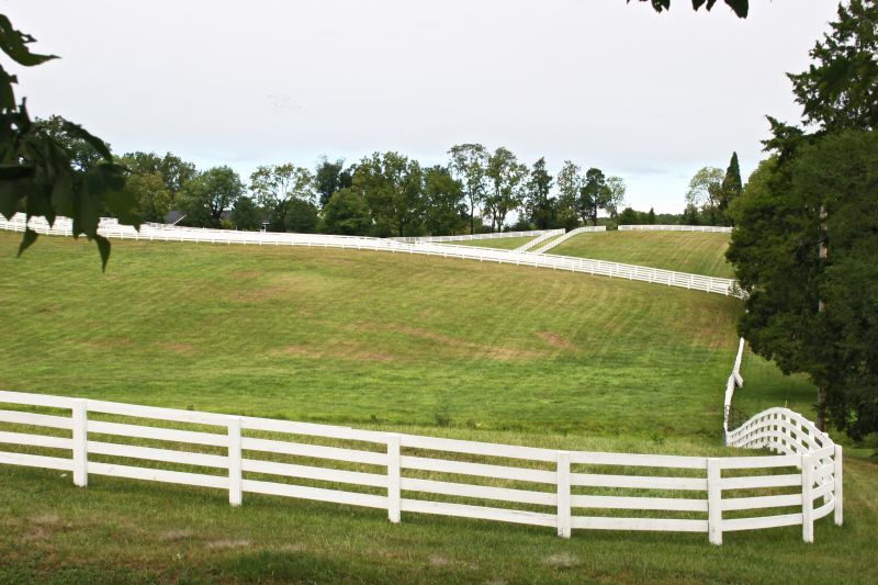 Farm fence installation team at work